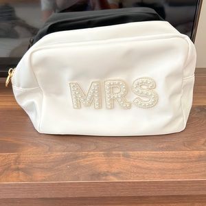 White travel bag perfect for toiletries and for the Mrs.